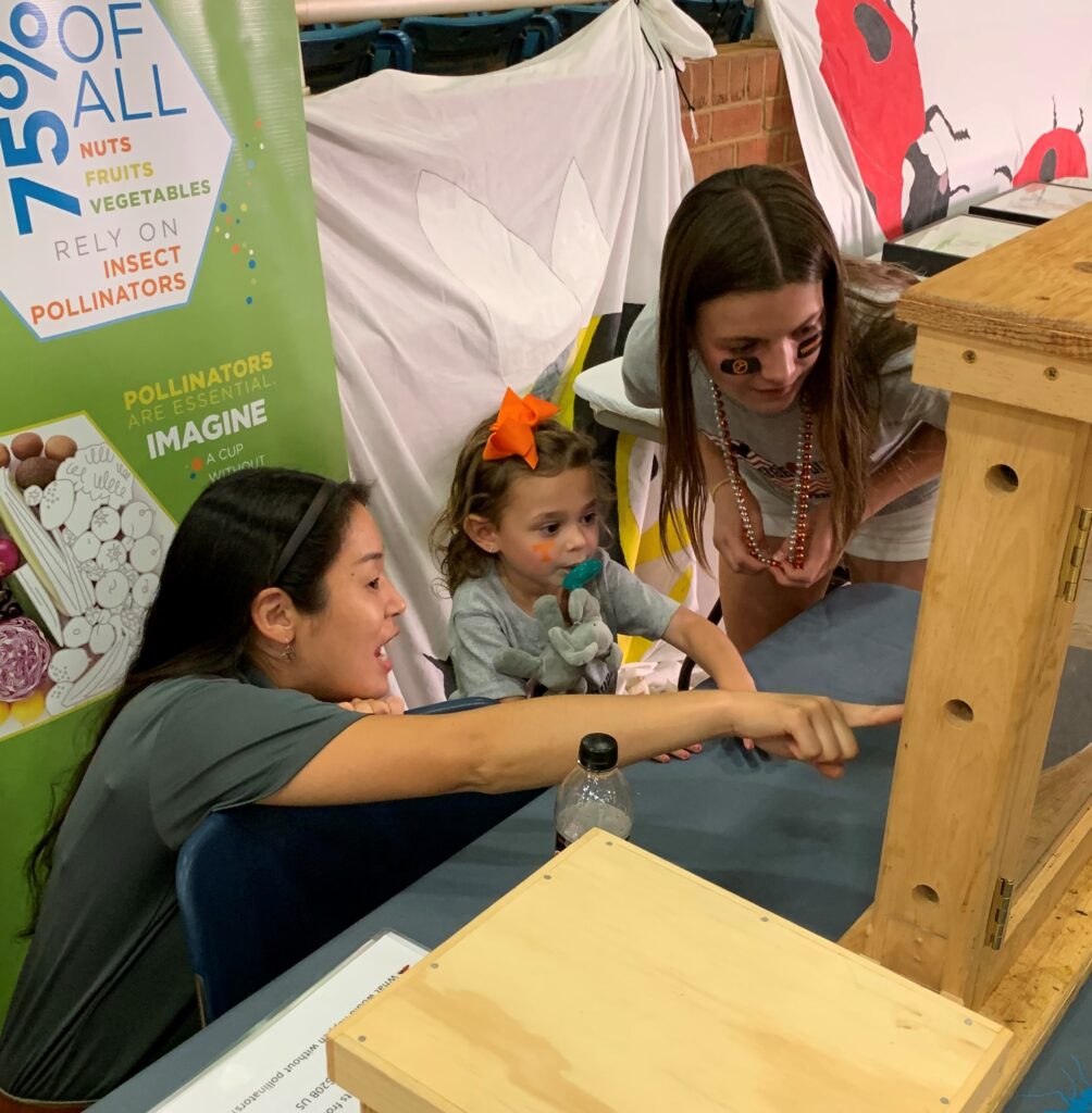 Assistant professor Jennifer Tsuruda showing young, curious minds the world of honey bees