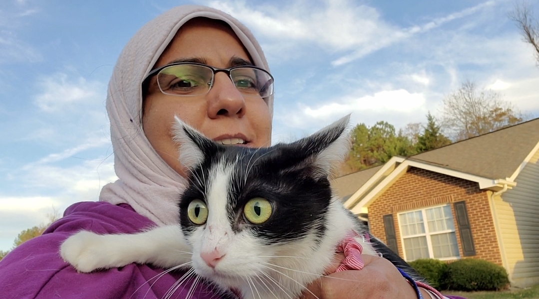 Heba Abdelgaffar holding a cat.